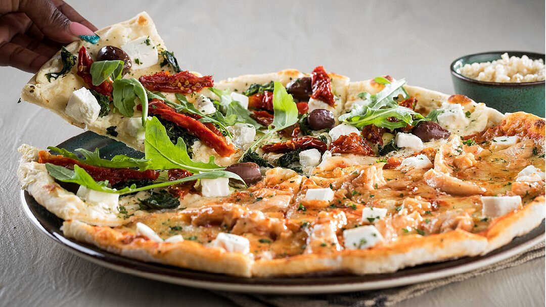 Feta, olive, tomato and rocket pizza